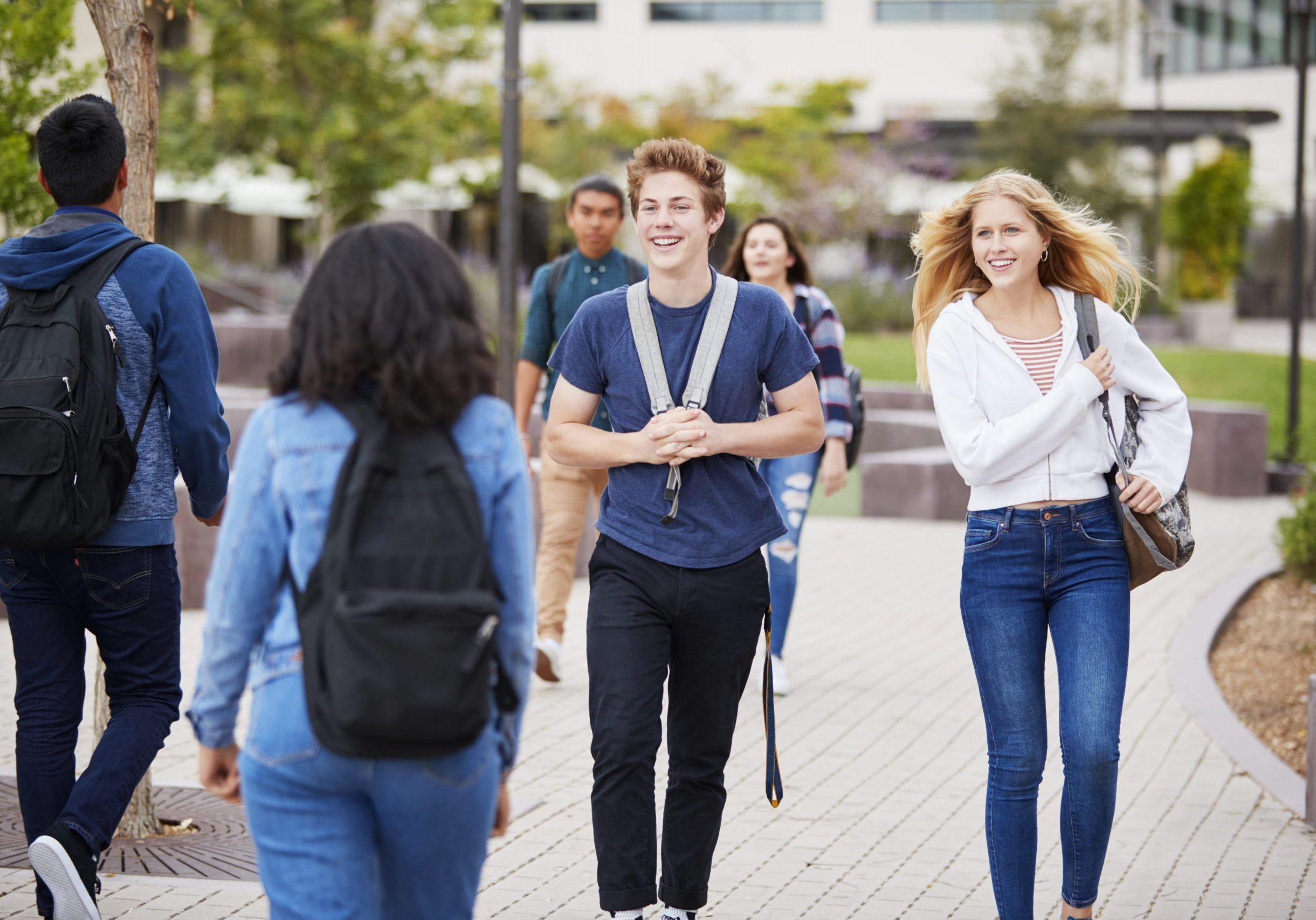 High School Students Socializing Outside College Buildings